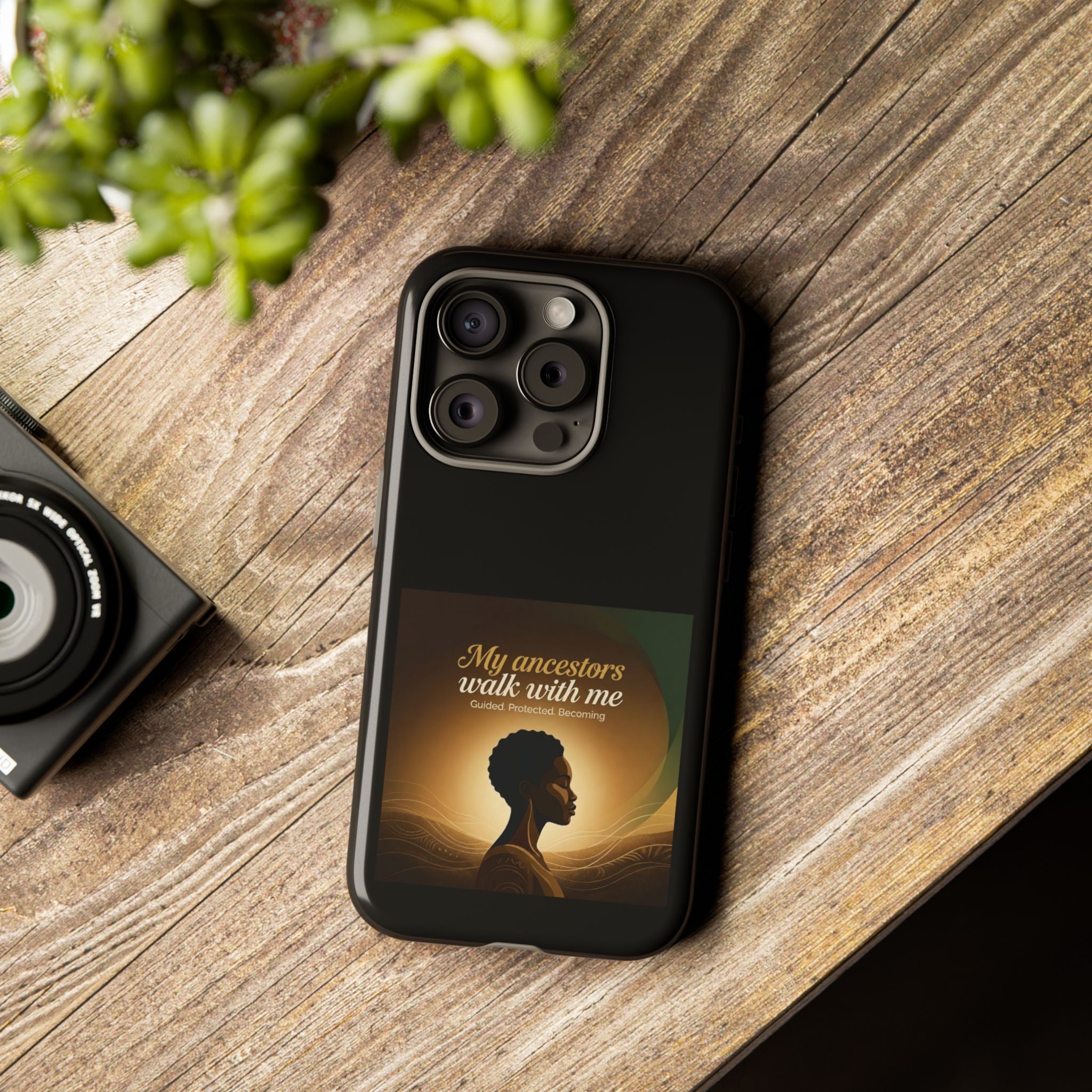 Black phone case with inspirational text honoring ancestors, designed by Printify, for protection and cultural expression.