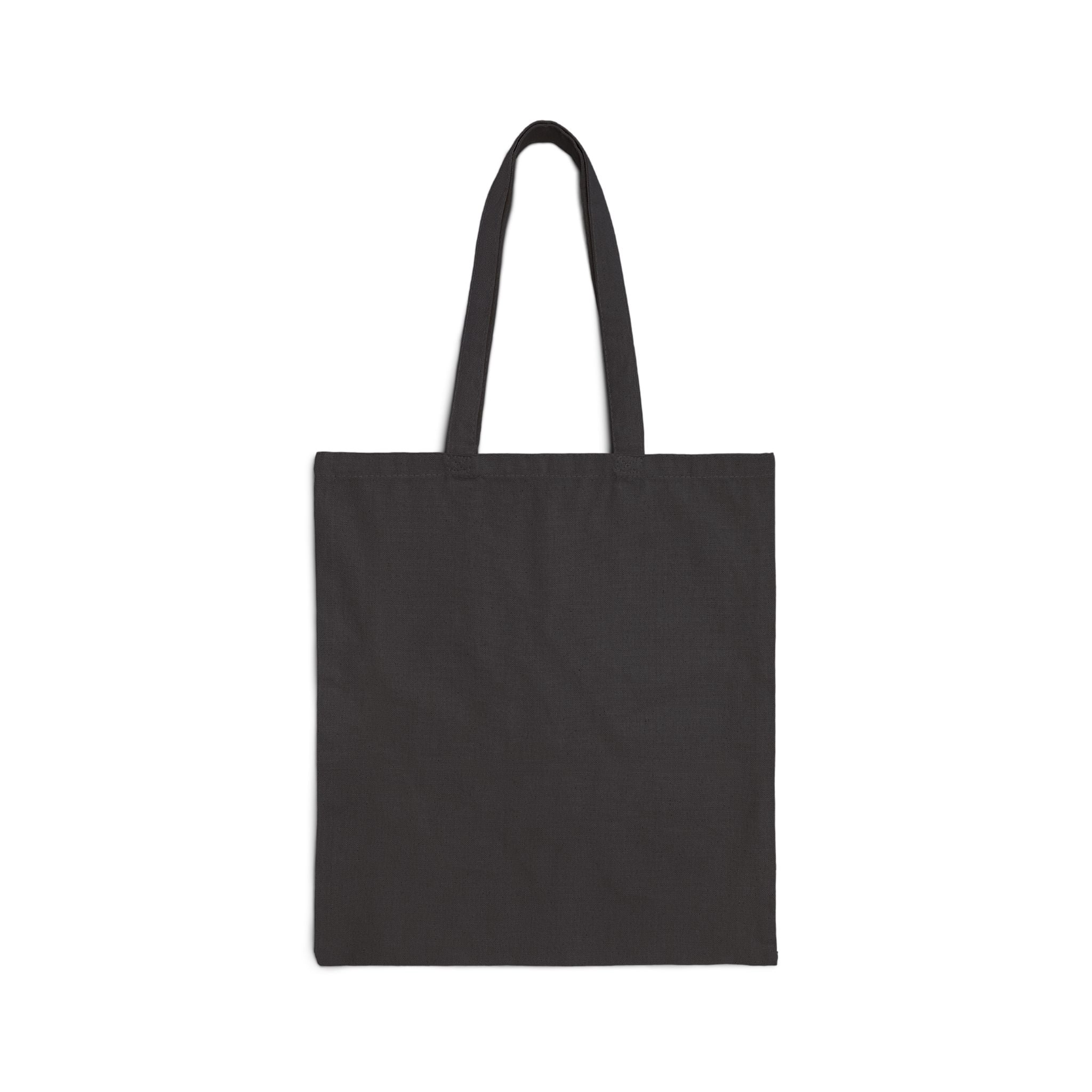 Canvas tote bag with "My Ancestors Walk With Me" silhouette design, featuring inspirational text and black handles.
